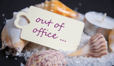 out of office tag resting on seashells | long service leave qld | MGI South Qld