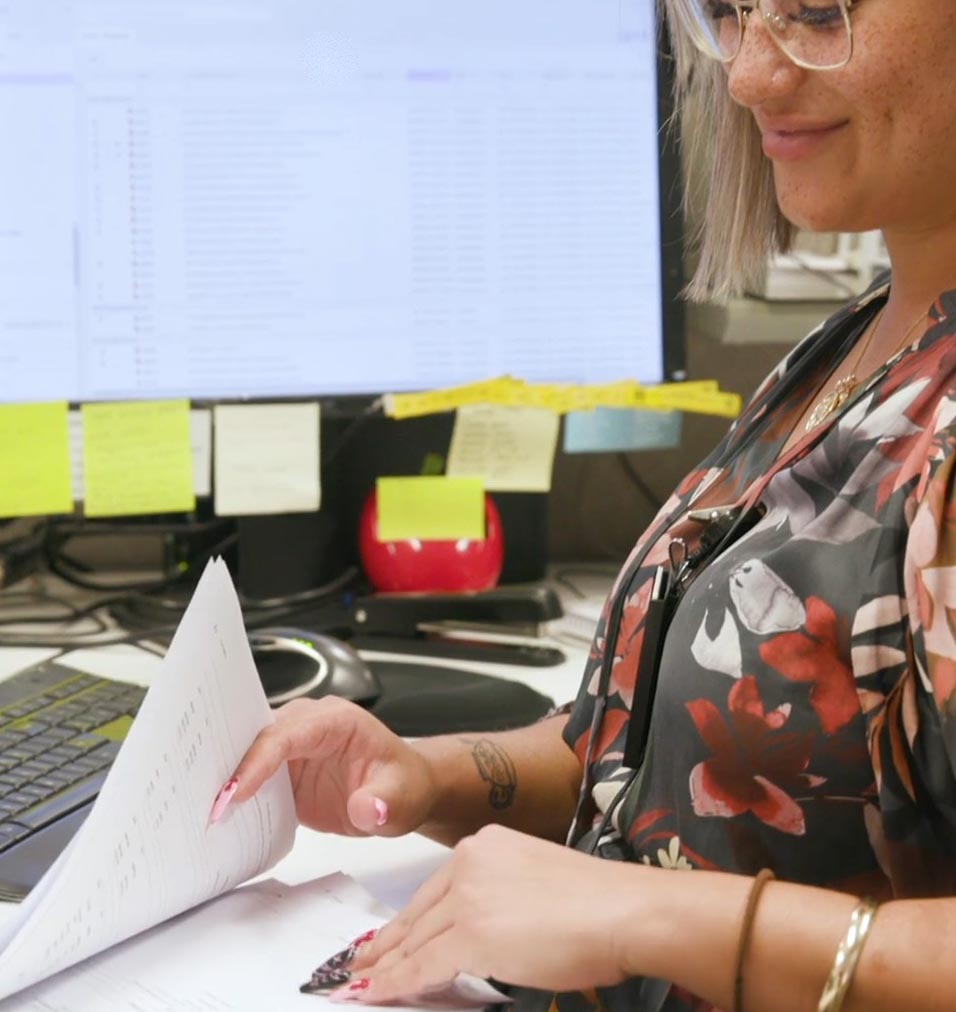 a female aged care accountant reviewing documents