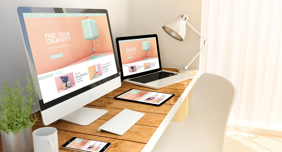 multiple devices on desk showing same website | shorter domain names available | MGI
