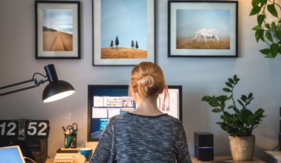 woman with back to camera working from home