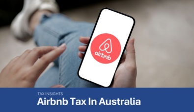 hands holding mobile phone with airbnb logo pictured