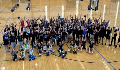 large group of participants on a basketball court