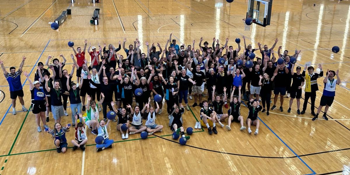 large group of participants on a basketball court