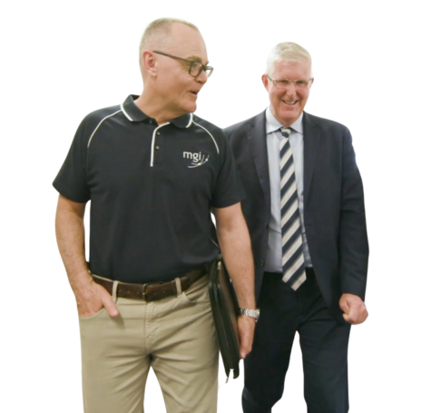 an MGI Brisbane business accountant walking with a client in a business suit