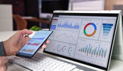 financial performance metrics shown as charts on both a tablet device and a mobile phone