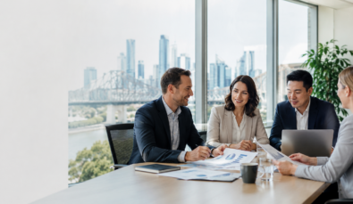 four people in a business meeting used on a blog about payroll tax for growing businesses in qld