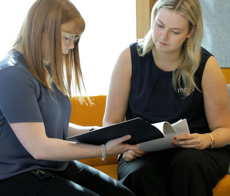 an mgi small business accountant working with a client